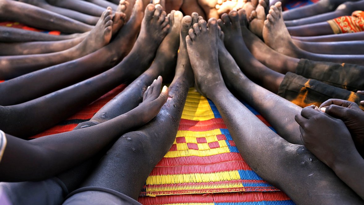 Children sitting together during a War Child's TeamUp session in South Sudan