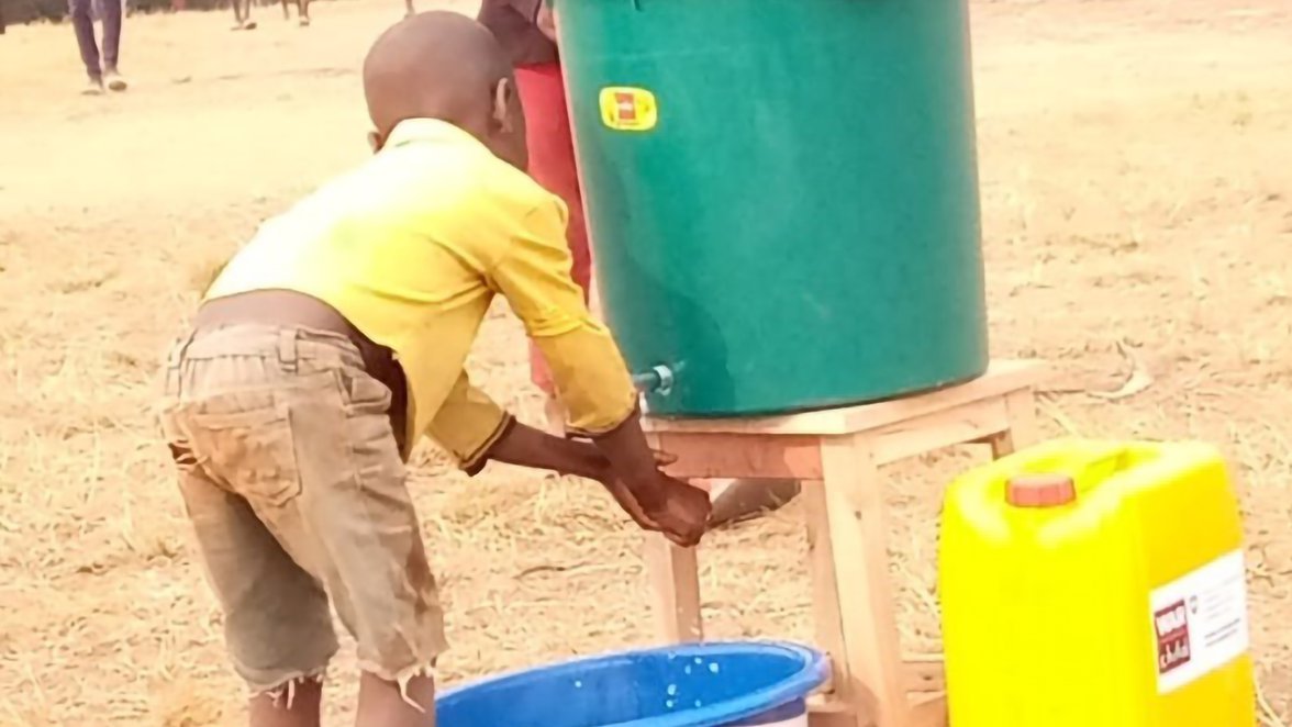 Washing hands at a water tank to combat the growing number of COVID-19 cases in Burundi_War Child