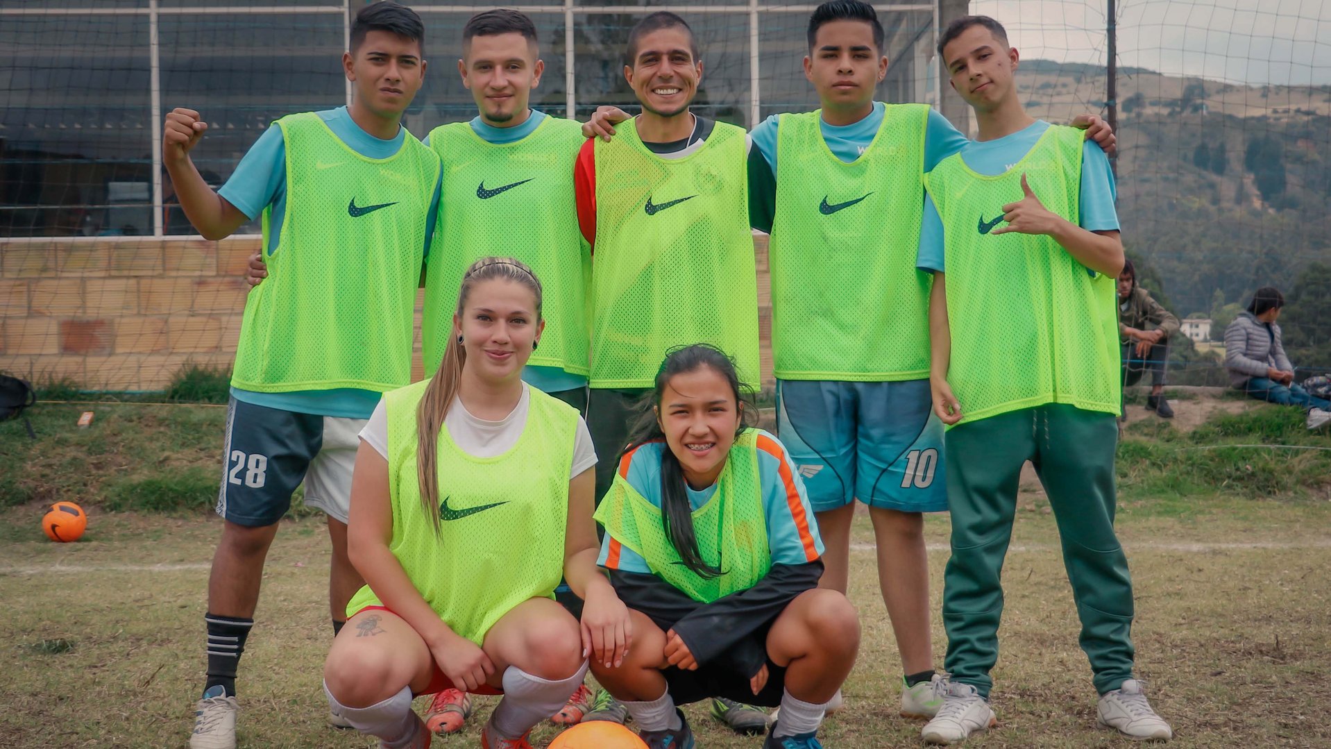 War Child Colombia Play it For Life participants standing in a group on a football field